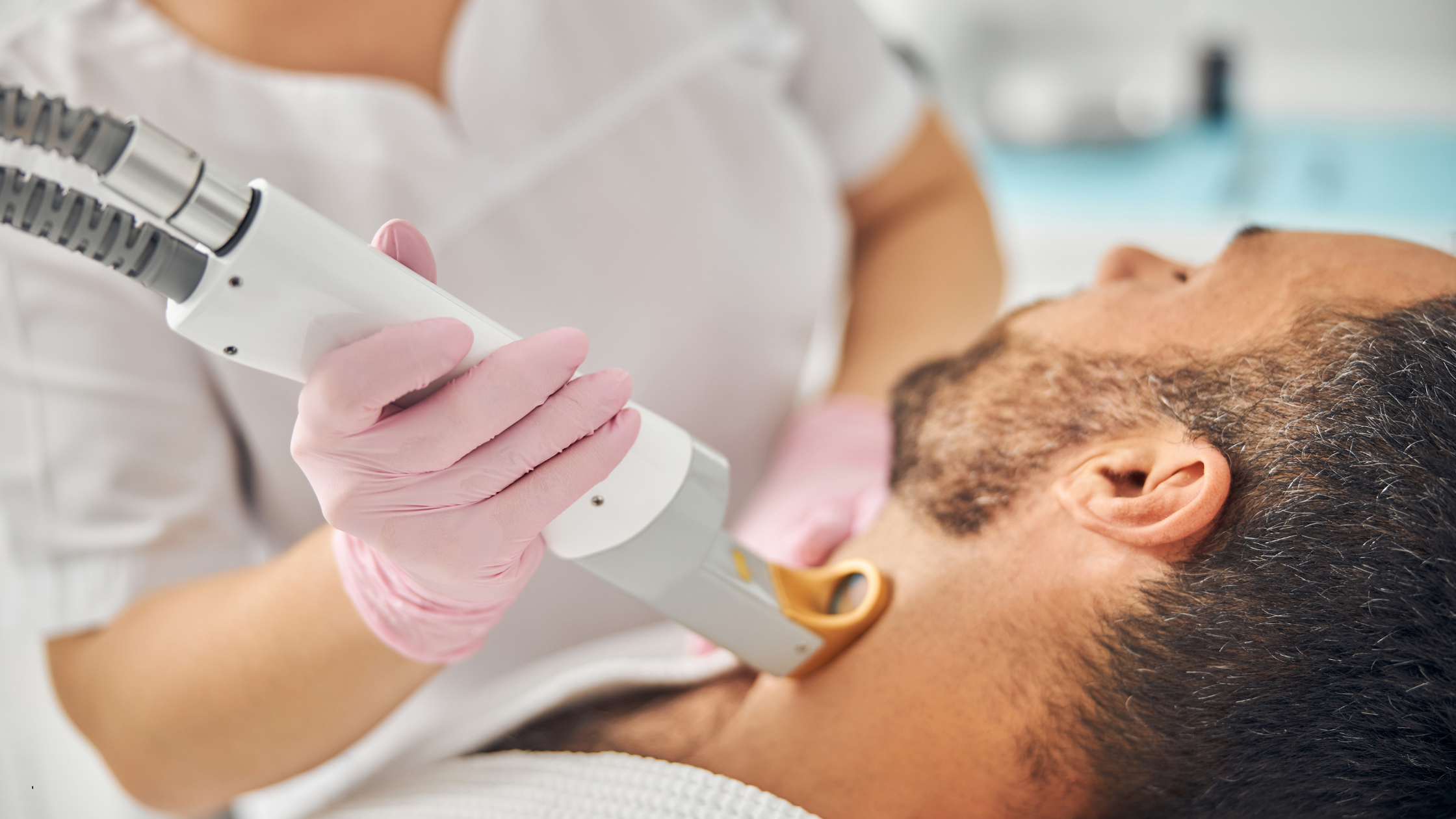 man receiving laser hair removal in Manchester clinic