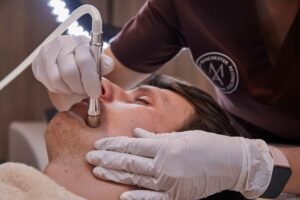 Advanced facial skin treatment being performed on a male client by a trained practitioner in Manchester