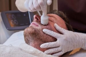 Radio frequency skin tightening facial performed on a male client at a Manchester aesthetic clinic