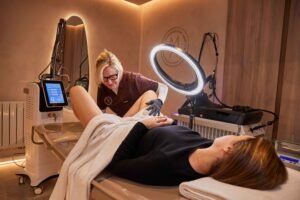 Professional therapist performing V'juve vaginal rejuvenation treatment at Manchester Aesthetics using advanced laser technology