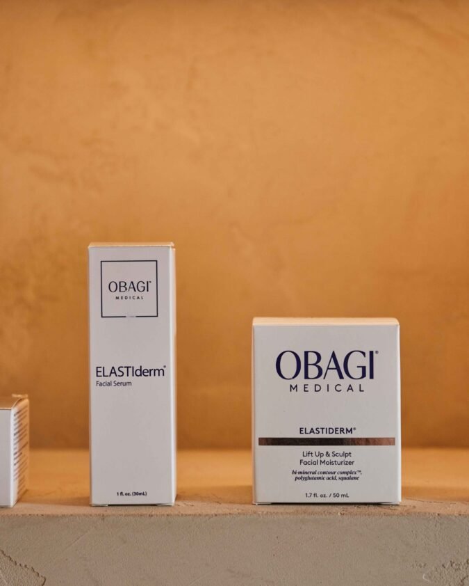 Full range of Obagi ELASTIderm anti-aging skincare products displayed on shelf showing eye cream lift serum and neck decollete treatment