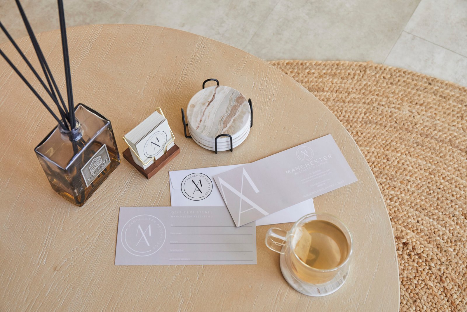 Luxury gift card with flowers on a treatment room table