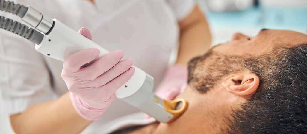 man receiving laser hair removal in Manchester clinic
