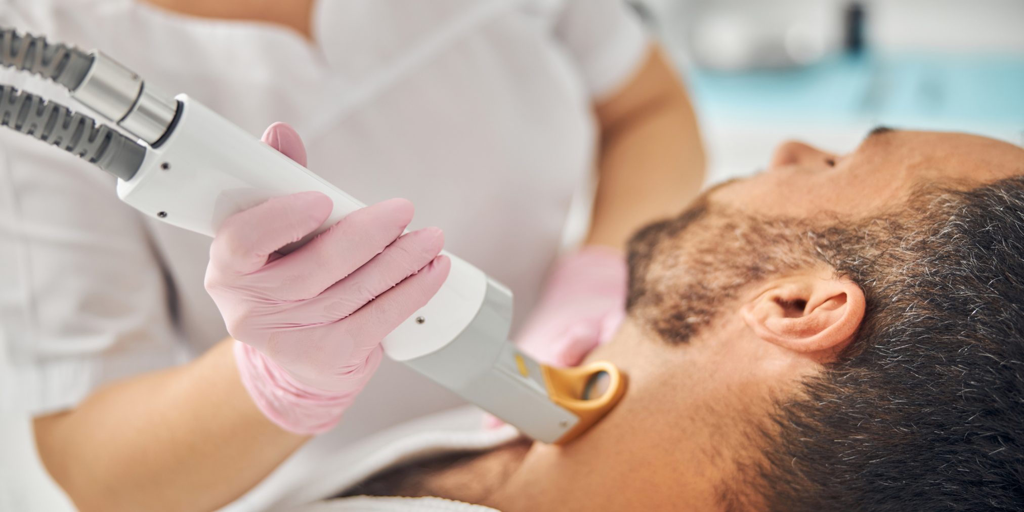 man receiving laser hair removal in Manchester clinic